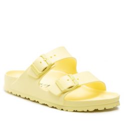 Klapki Birkenstock. Żółte klapki damskie Birkenstock, bez wzorów, bez obcasa, bez zapięcia. Za 249.99 zł.