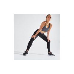 Legginsy fitness kardio damskie 100 czarne. Czarne legginsy damskie DOMYOS, bez wzorów, z elastanu. Za 49.99 zł.