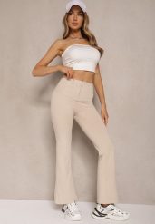 Beżowe Spodnie Dzwony High Waist Odavia. Brązowe spodnie materiałowe damskie Renee, bez wzorów, z jeansu, eleganckie, z podwyższonym stanem. Za 59.99 zł.
