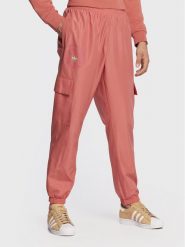 Adidas Spodnie dresowe Ozworld HL9254 Pomarańczowy Regular Fit. Brązowe spodnie sportowe męskie Adidas, m, bez wzorów, z dresówki. Za 209.99 zł.