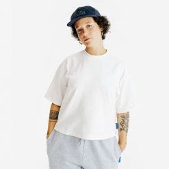 Koszulka Crop damska. Białe bluzki damskie Decathlon, xl, bez wzorów, z bawełny, bez kołnierzyka, bez ramiączek. Za 54.99 zł.