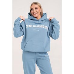 Bluza fitness damska Gym Glamour college sky. Niebieskie bluzy damskie GYM GLAMOUR, xl, bez wzorów, glamour, bez ramiączek, bez kaptura. Za 199.99 zł.