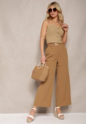 Brązowe Spodnie z Szerokimi Nogawkami w Stylu Palazzo High Waist z Gumką w Pasie z Ozdobnym Elementem Ellsiana. Brązowe spodnie materiałowe damskie Renee, bez wzorów, z bawełny, eleganckie, z podwyższonym stanem. Za 44.99 zł.