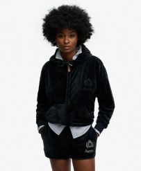 Superdry Country Club Velour Zip Hoodie – welurowa bluza z kapturem oversize. Niebieskie bluzy damskie Superdry, bez wzorów, z elastanu, eleganckie, bez ramiączek, z kapturem. Za 423.85 zł.