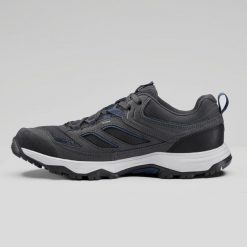 Buty turystyczne męskie Quechua MH100. Niebieskie buty zimowe męskie QUECHUA, bez wzorów, z kauczuku, bez obcasa, bez zapięcia. Za 179.99 zł.
