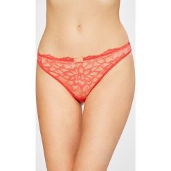 Triumph - Stringi Dream Spotlight. Pomarańczowe majtki damskie Triumph, z elastanu. W wyprzedaży za 29.90 zł.