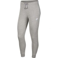 Spodnie sportowe damskie Nike Essential Pant Reg Fleece. Szare spodnie dresowe damskie Nike, bez wzorów, z dresówki, sportowe, długie. Za 301.00 zł.