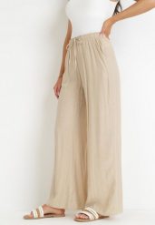 Beżowe Szerokie Spodnie z Wiskozy Zyona. Brązowe spodnie materiałowe damskie Born2be, bez wzorów, z jeansu, eleganckie. Za 59.99 zł.