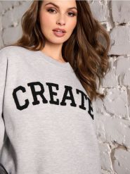 Bluza z napisem - szary. Szare bluzy damskie Sinsay, l, bez wzorów, bez ramiączek, bez kaptura. Za 49.99 zł.