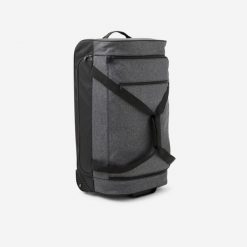 Torba podróżna na kółkach Kipsta Essential 70 l. Czarne torby podróżne damskie Decathlon, bez wzorów, z materiału. Za 249.99 zł.