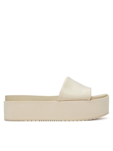 Calvin Klein Jeans Klapki Flatform Sandal Slide In Nylon YW0YW01791 Écru. Klapki damskie Calvin Klein Jeans, bez wzorów, z jeansu, bez obcasa, bez zapięcia. Za 199.99 zł.