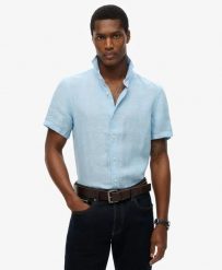 Superdry Koszula Vacation Linen krótki rękaw 100% len Sea Blue Chambray. Niebieskie koszule damskie Superdry, na lato, s, bez wzorów, ze lnu, klasyczne, bez kołnierzyka, bez ramiączek. Za 322.70 zł.