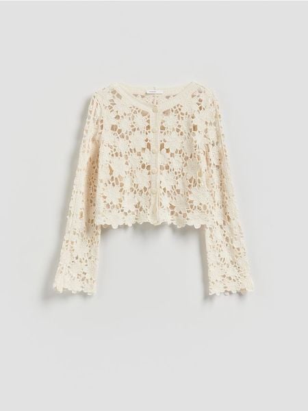 Crochetowy kardigan - kremowy. Białe kardigany damskie Reserved, l, bez wzorów, z bawełny, bez kołnierzyka. Za 119.99 zł.