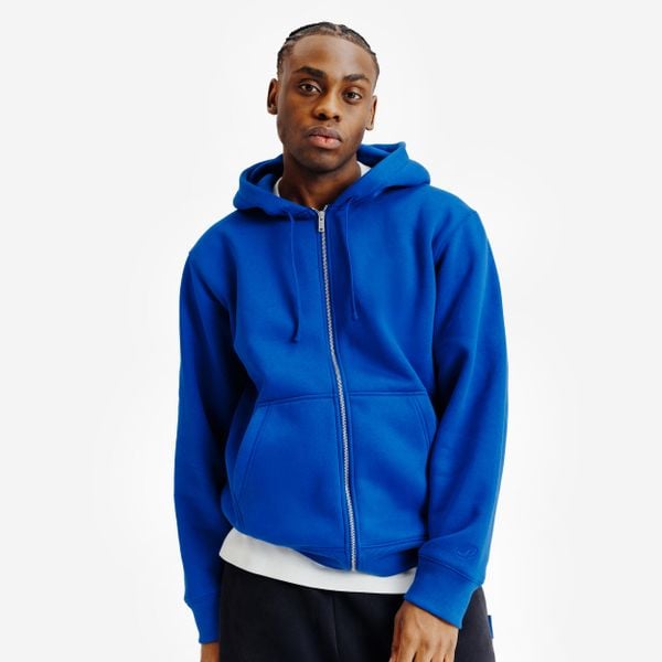 Bluza na suwak unisex Elementals. Niebieskie bluzy damskie Decathlon, uniwersalny, bez wzorów, z bawełny, bez ramiączek, z kapturem. W wyprzedaży za 119.99 zł.