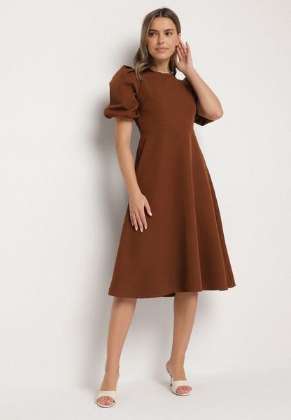 Brązowa Sukienka o Rozkloszowanym Kroju z Bufiastymi Rękawami Melisseia. Brązowe sukienki damskie Born2be, na spotkanie biznesowe, l, bez wzorów, klasyczne, bez kołnierzyka, bez ramiączek, midi, rozkloszowane. Za 99.99 zł.