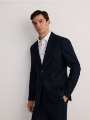 Lniana marynarka regular fit - granatowy. Niebieskie garnitury męskie Reserved, bez wzorów. W wyprzedaży za 259.99 zł.