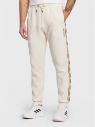 Guess Spodnie dresowe Mickey Z2YB09 KB3P2 Écru Regular Fit. Spodnie sportowe męskie Guess, m, z aplikacjami, z bawełny. Za 379.99 zł.