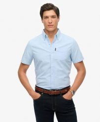 Superdry Oxford Short Sleeve Shirt – koszula Oxford krótki rękaw 100% bawełna. Niebieskie koszule damskie Superdry, s, bez wzorów, z bawełny, casualowe, bez kołnierzyka, bez ramiączek. Za 279.65 zł.