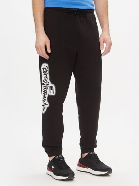 Tommy Jeans Spodnie dresowe Tjm Reg Tommy Spray Sweatpant DM0DM18376 Czarny Regular Fit. Czarne spodnie sportowe męskie Tommy Jeans, m, bez wzorów, z dresówki. Za 249.99 zł.