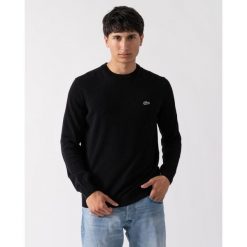 Klasyczny sweter Lacoste z czarnej bawełny organicznej. Czarne swetry męskie Lacoste, m, bez wzorów, z bawełny, casualowe, bez kołnierzyka, bez ramiączek. Za 653.40 zł.