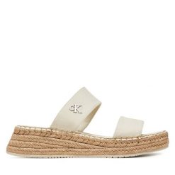 Klapki Calvin Klein Jeans. Brązowe klapki damskie Calvin Klein Jeans, bez wzorów, z jeansu, sportowe, bez obcasa, bez zapięcia. Za 157.99 zł.