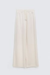 Spodnie damskie dresowe z szeroką nogawką kremowe Lunarap 102. Białe spodnie dresowe damskie BIG STAR, bez wzorów, z dresówki, eleganckie. Za 179.99 zł.