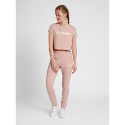 Damska koszulka crop top Hummel Legacy. Białe topy damskie Hummel, m, bez wzorów, sportowe, bez kołnierzyka, bez ramiączek. Za 94.00 zł.