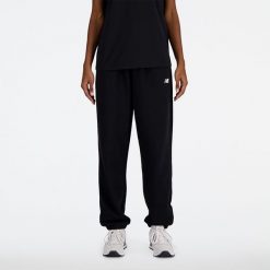 Spodnie damskie New Balance WP41500BK – czarne. Czarne spodnie dresowe damskie New Balance, bez wzorów, z bawełny, klasyczne. Za 249.99 zł.