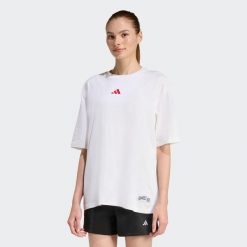 Koszulka Mini Embroidery Oversized Graphic. Białe bluzki damskie Adidas, bez wzorów, casualowe, bez kołnierzyka, bez ramiączek. Za 129.00 zł.
