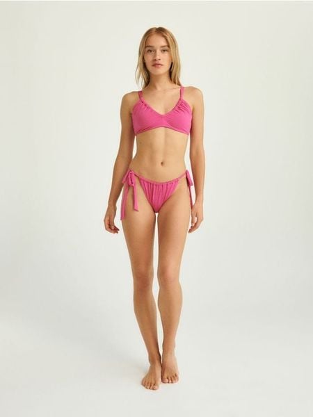 Góra od bikini - fuksja. Czerwone stroje kąpielowe damskie Reserved, bez wzorów, z poliamidu. W wyprzedaży za 19.99 zł.