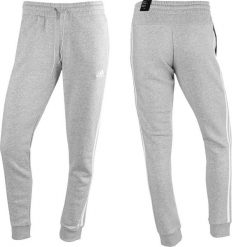 Adidas Spodnie damskie adidas Essentials 3-Stripes Fleece szare IL3282 XL. Szare spodnie dresowe damskie Adidas, bez wzorów, sportowe. Za 182.12 zł.