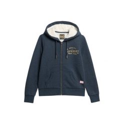 Kurtka z kapturem z zamkiem i metalowym logo dla kobiet Superdry Luxe. Niebieskie koszulki sportowe damskie Superdry, bez wzorów, bez ramiączek, z kapturem. W wyprzedaży za 364.50 zł.