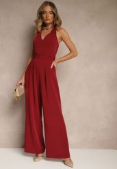 Bordowy Kombinezon o Taliowanym Kroju z Dekoltem Halter i Wiązanym Paskiem Malisena. Czerwone sukienki damskie Renee, na co dzień, l, bez wzorów, eleganckie, bez kołnierzyka, bez ramiączek. Za 99.99 zł.