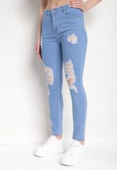Niebieskie Dopasowane Jeansy Push-Up z Przetarciami i Regularnym Stanem Delosia. Niebieskie jeansy damskie Born2be, bez wzorów, z denimu, biznesowe. Za 54.99 zł.