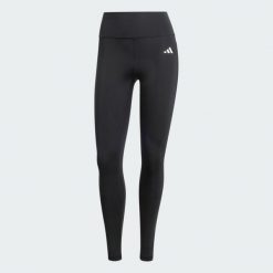 Długie legginsy Optimé Essentials Stash Pocket. Czarne legginsy damskie Adidas, bez wzorów, z elastanu. Za 199.00 zł.