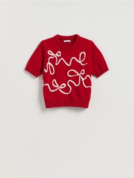 Sweter z kokardkami - czerwony. Czerwone swetry nierozpinane damskie Reserved, l, bez wzorów, z dzianiny, bez kołnierzyka, bez ramiączek. W wyprzedaży za 79.99 zł.