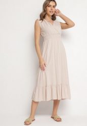 Beżowa Wiskozowa Sukienka o Kopertowym Kroju z Falbanką Uliria. Brązowe sukienki damskie Born2be, na spotkanie biznesowe, l, bez wzorów, z wiskozy, eleganckie, bez kołnierzyka, bez ramiączek, midi, kopertowe. Za 64.99 zł.