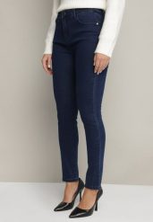 Granatowe Jeansy o Fasonie Slim z Regularnym Stanem Zelzedis. Niebieskie jeansy damskie Born2be, na jesień, bez wzorów, z bawełny, eleganckie. Za 24.99 zł.