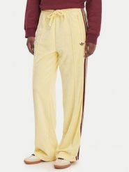 Adidas Spodnie dresowe Terry Towel Firebird KQ6662 Żółty Loose Fit. Żółte spodnie dresowe damskie Adidas, bez wzorów, z bawełny. Za 348.99 zł.