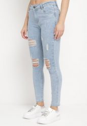 Jasnoniebieskie Klasyczne Dopasowane Jeansy na Suwak z Przetarciami Anenstala. Niebieskie jeansy damskie Born2be, na lato, bez wzorów, z jeansu, klasyczne. Za 64.99 zł.