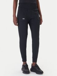 Under Armour Spodnie dresowe Motion 1375077 Czarny Slim Fit. Czarne spodnie dresowe damskie Under Armour, bez wzorów, z dresówki, sportowe. Za 239.99 zł.