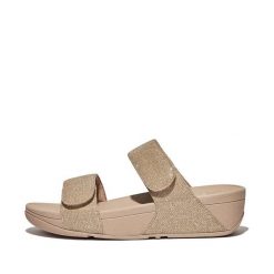 Kobiece klapki na koturnie FitFlop Lulu Adjustable. Brązowe klapki damskie FIT FLOP, na lato, bez wzorów, z materiału, eleganckie, bez obcasa, na koturnie, bez zapięcia. Za 510.00 zł.