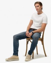 Superdry Jeansy Slim Vintage z Bawełny Organicznej – Storm Blue. Niebieskie jeansy damskie Superdry, z aplikacjami, z bawełny, boho. Za 478.55 zł.