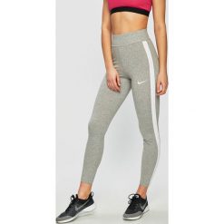 Nike Sportswear - Legginsy. Niebieskie legginsy damskie Nike Sportswear, bez wzorów, z bawełny. W wyprzedaży za 119.90 zł.