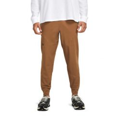 Spodnie dresowe męskie Under Armour UNSTOPPABLE JOGGERS. Brązowe spodnie sportowe męskie Under Armour, m, bez wzorów, z dresówki, na fitness i siłownię. Za 279.99 zł.