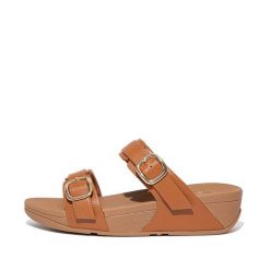 Kobiece klapki na koturnie FitFlop Lulu. Brązowe klapki damskie FIT FLOP, bez wzorów, eleganckie, bez obcasa, na koturnie, bez zapięcia. Za 565.50 zł.