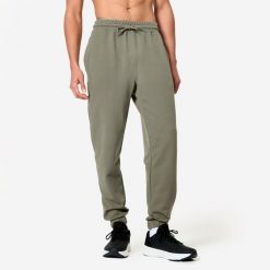 Spodnie fitness męskie Domyos Gym & Pilates slim. Brązowe spodnie sportowe męskie NYAMBA, l, bez wzorów, z dresówki, na fitness i siłownię. Za 79.99 zł.