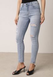 Niebieskie Bawełniane Jeansy o Kroju Slim z Przetarciami Elledima. Niebieskie jeansy damskie Born2be, bez wzorów, z bawełny, eleganckie. Za 99.99 zł.