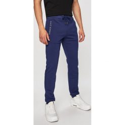 Versace Jeans - Spodnie. Niebieskie spodnie materiałowe męskie Versace Jeans, bez wzorów, z bawełny. W wyprzedaży za 319.90 zł.