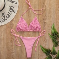Bikini wiązane regulowane na plażę i basen Gorana. Białe bikini Intica, l, bez wzorów. Za 169.00 zł.
